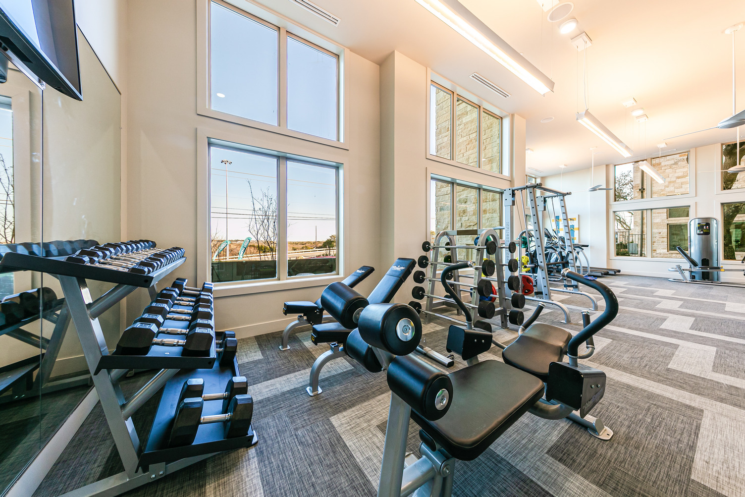 Strength training equipment and free weights in community fitness center