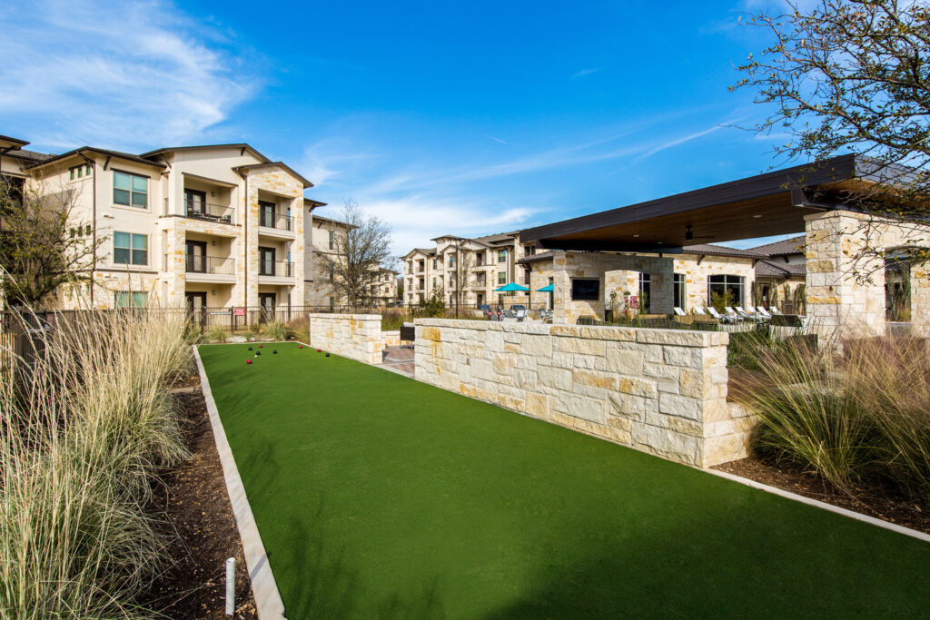 Outdoor putting green amenity near pool courtyard