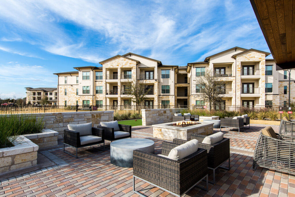 Outdoor courtyard with fire pit and lounge seating