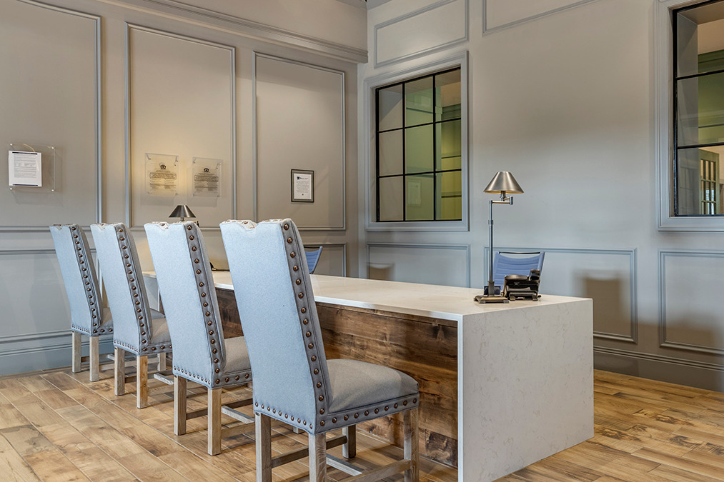 Leasing desk lobby and waiting area with chairs and wood-style flooring
