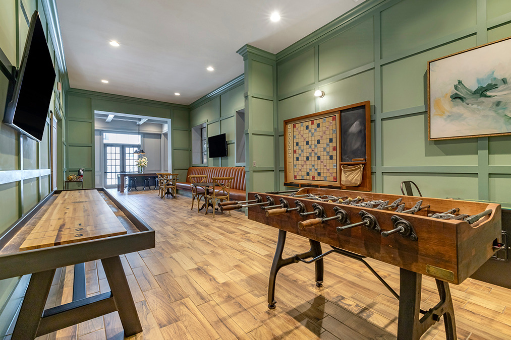 Clubroom and lounge with shuffleboard and foosball table