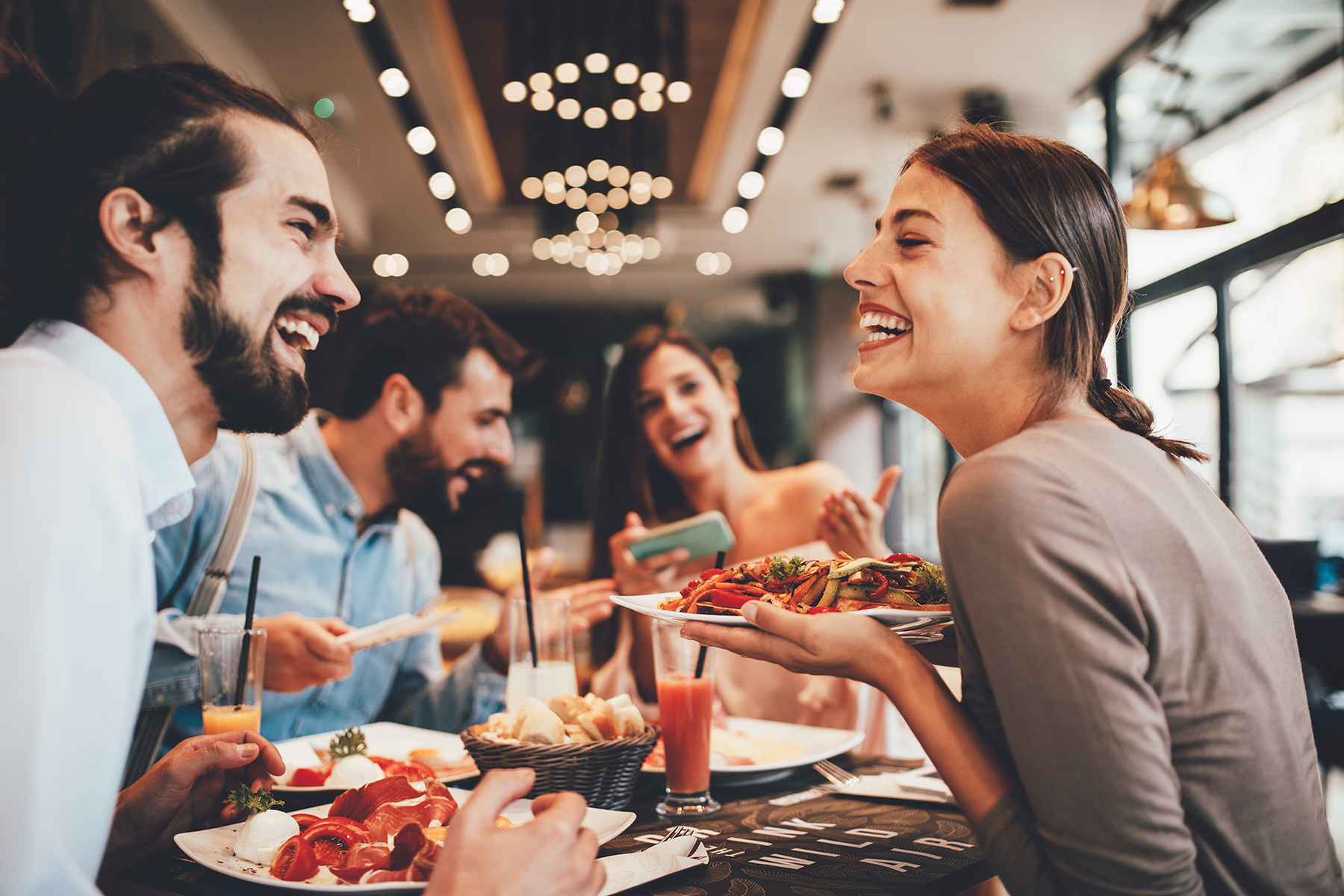 Group of friends eating lunch at a casual Austin restaurant